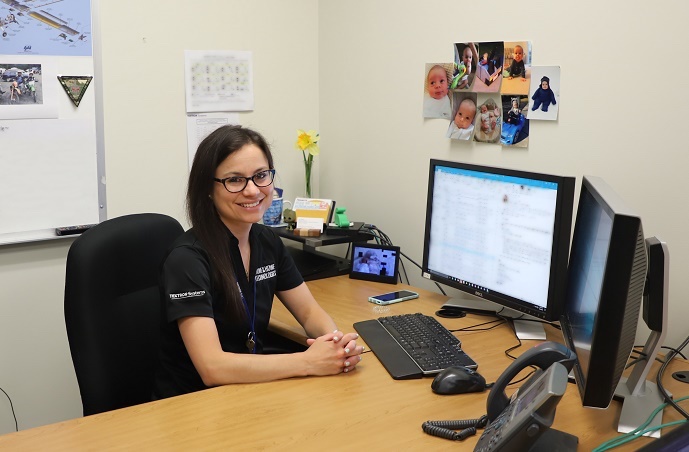 Sara Willett at desk