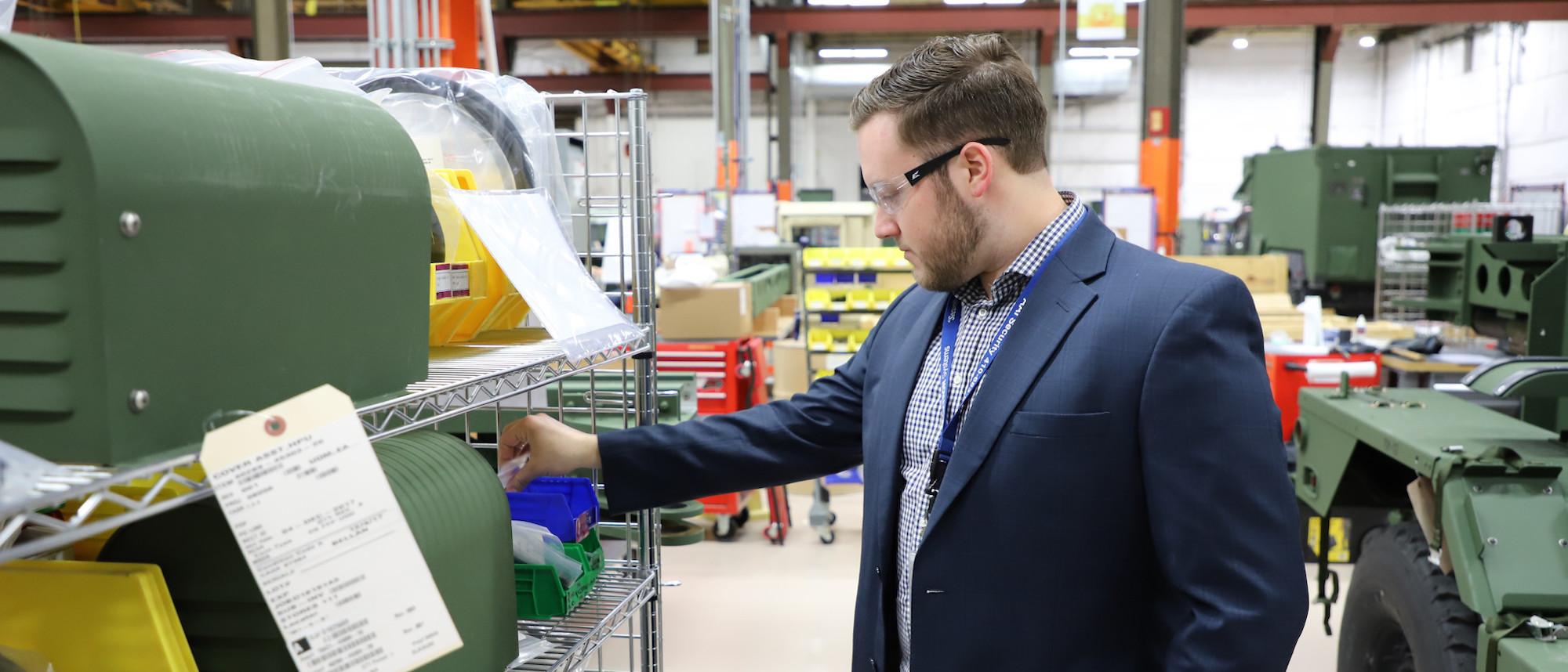 man looking at materials