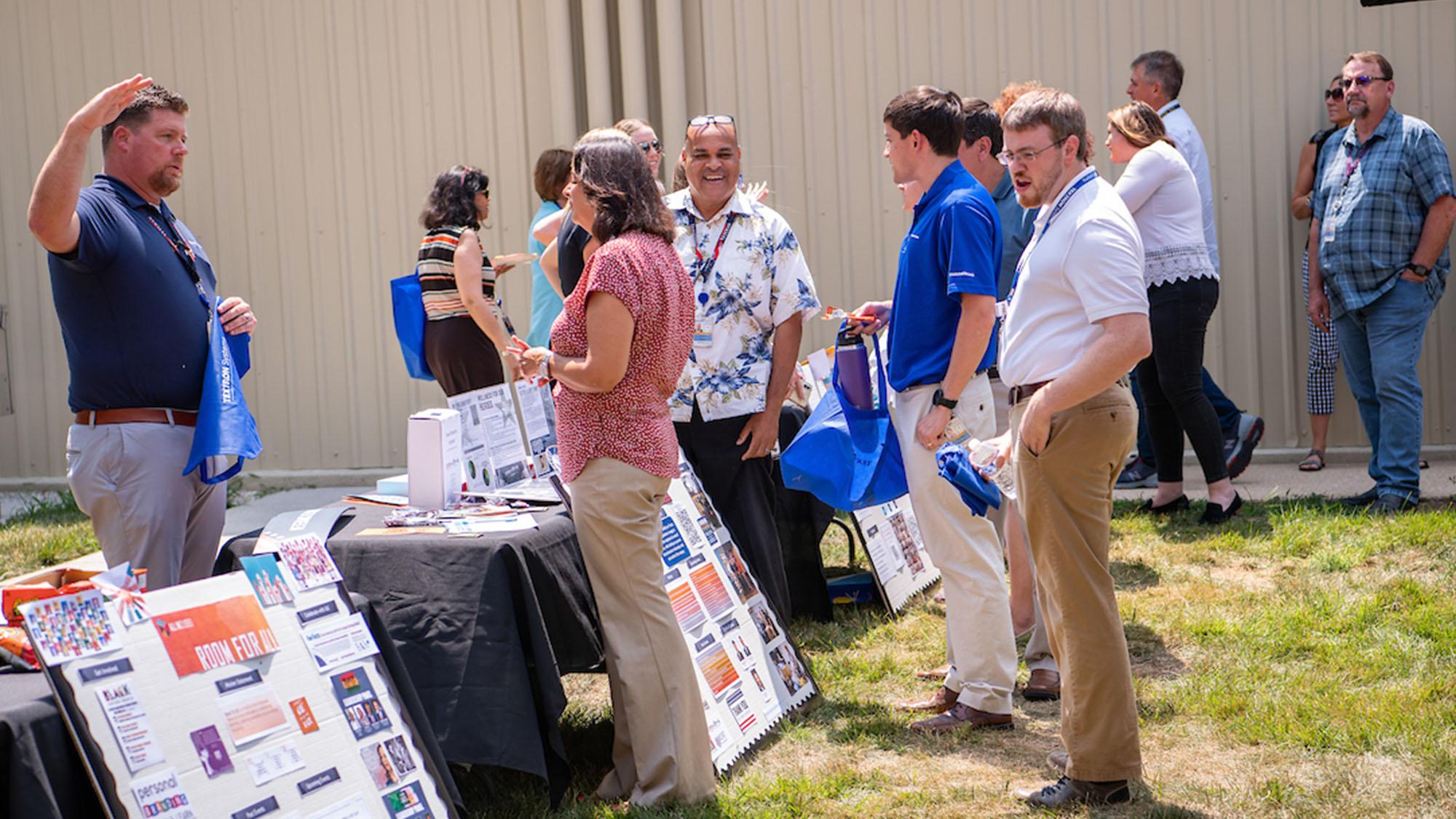 Textron Systems' employees in the courtyard