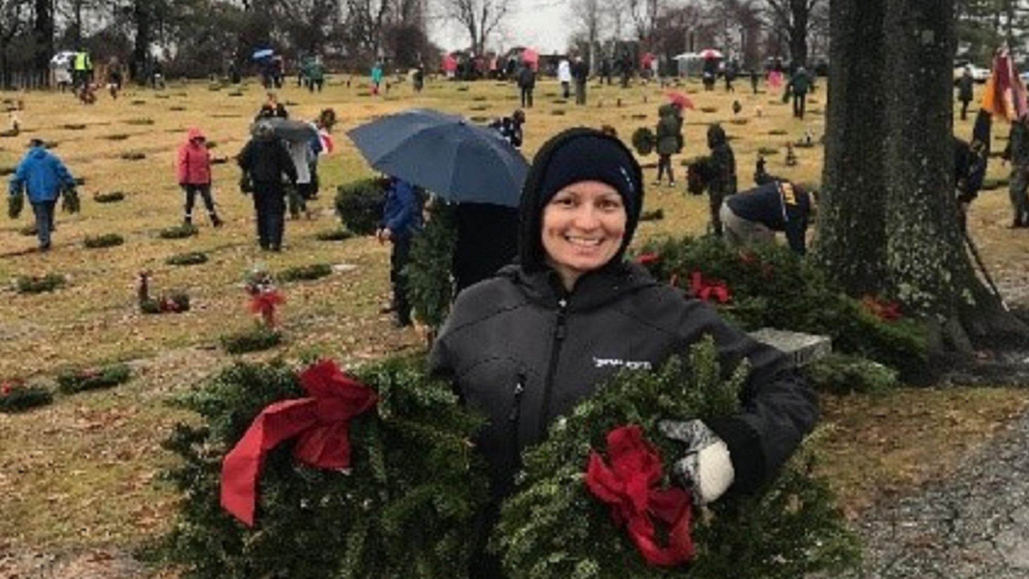 Volunteer laying wreaths at Dulaney Valley Memorial Garden.