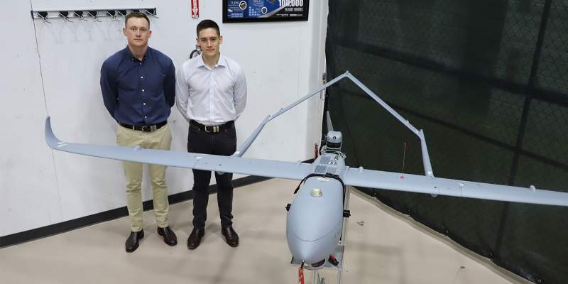 Australian Cadets Standing Next to Aerosonde