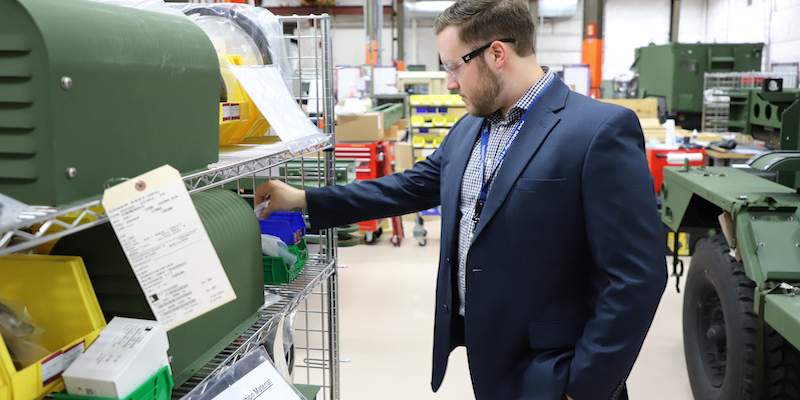 man looking at materials